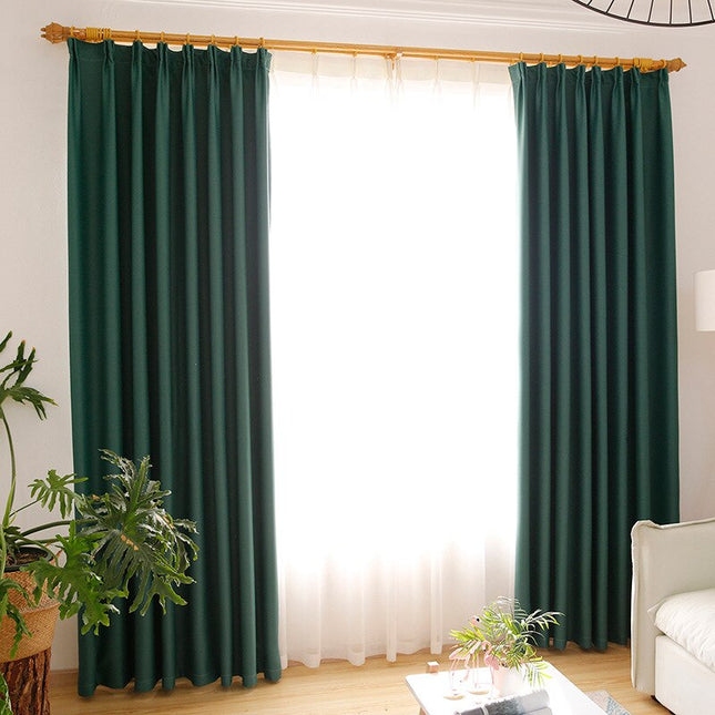 Ciemnozielona zasłona zaciemniająca do salonu