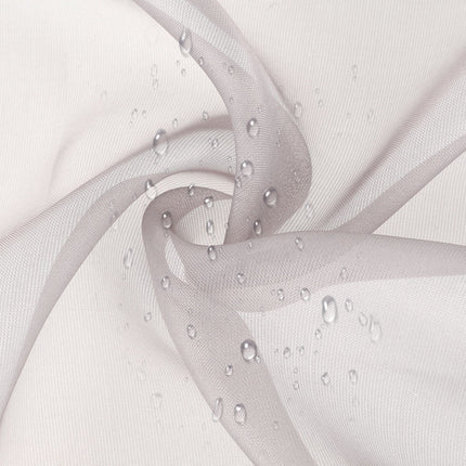 Szara zewnętrzna firana ombre na szelkach.