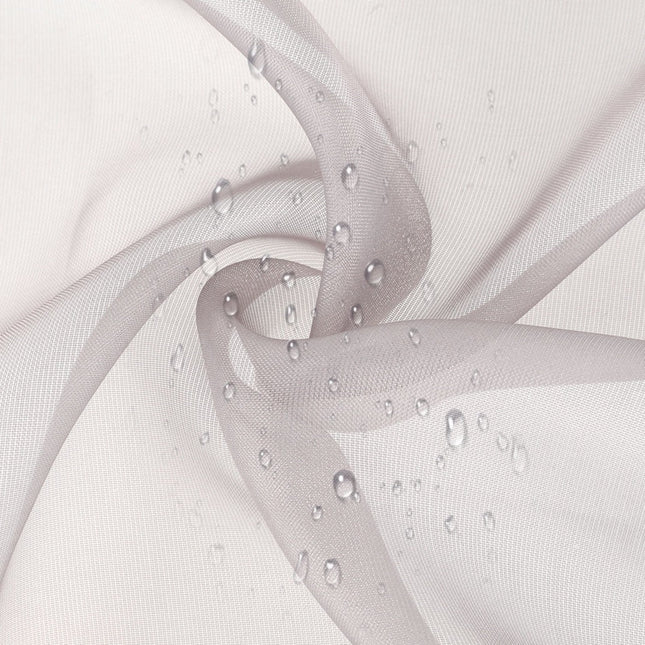 Szara zewnętrzna firana ombre na szelkach.