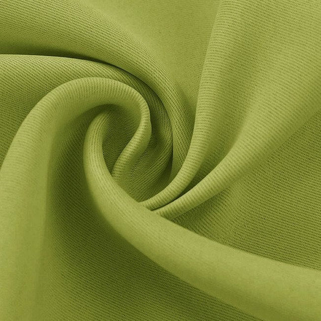 Zielona zasłona zaciemniająca w odcieniu jabłkowym