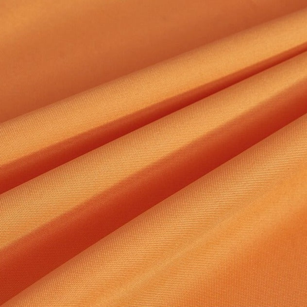 Pomarańczowa zasłona ogrodowa na altanę z przelotkami.